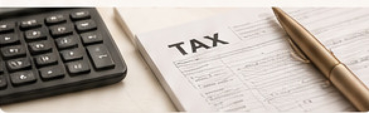 Calculator, tax forms and a gold pen